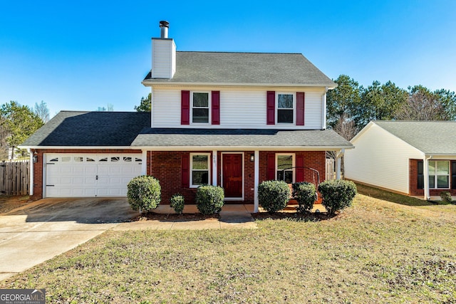 traditional-style house featuring a garage, brick siding, and concrete driveway