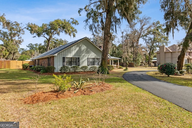 view of property exterior with a yard