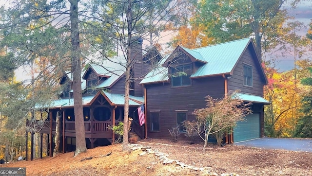 20 Walker Ridge Way Unit 36, 42, Mineral Bluff, GA 30559 - view of side of property featuring a garage, asphalt driveway, metal roof, and covered porch