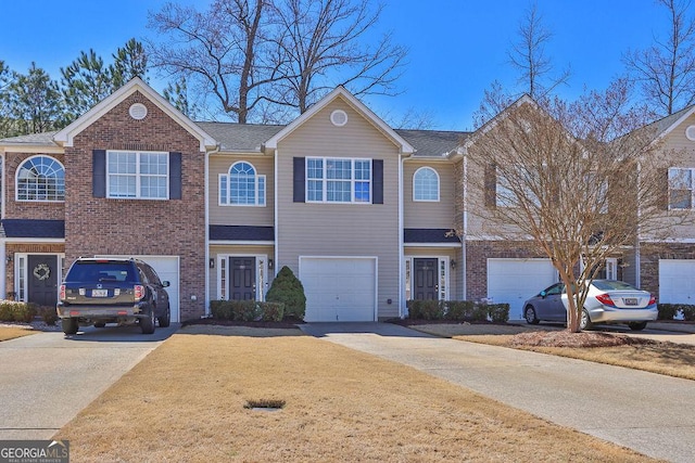 view of front of house with a garage, brick siding, concrete driveway, and a shingled roof