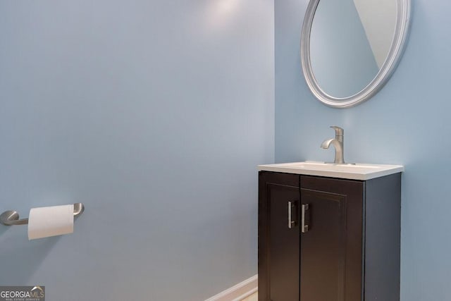 bathroom featuring baseboards and vanity