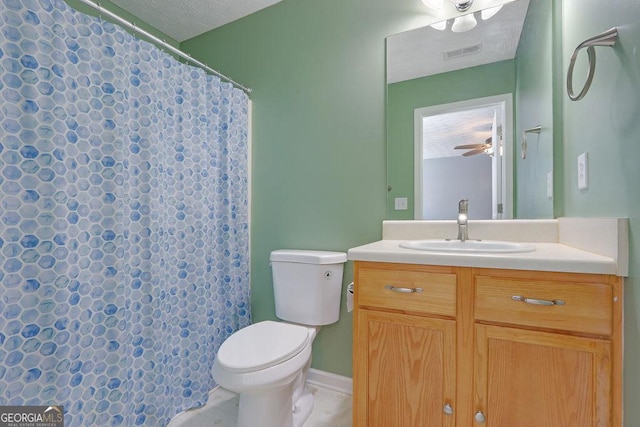 bathroom featuring vanity, a shower with curtain, visible vents, ceiling fan, and toilet