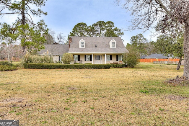 new england style home with a front yard