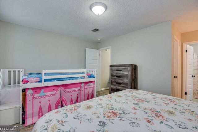 bedroom with a textured ceiling