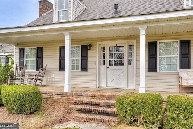 property entrance with covered porch