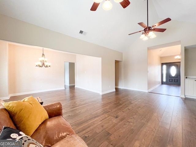 living room with hardwood / wood-style flooring, high vaulted ceiling, and ceiling fan with notable chandelier