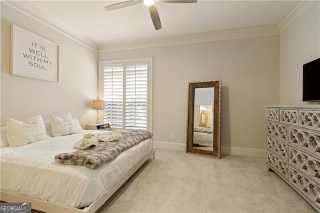 carpeted bedroom featuring crown molding and ceiling fan