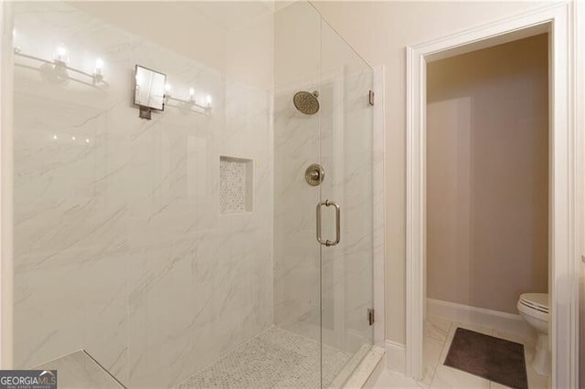 bathroom with an enclosed shower and toilet