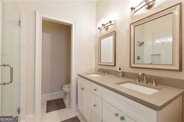 bathroom featuring vanity, toilet, and walk in shower