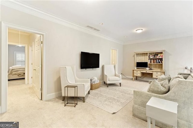 carpeted living room featuring ornamental molding