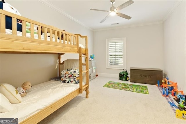 carpeted bedroom with ceiling fan and crown molding