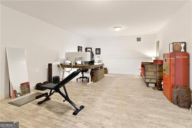 office space with light wood-type flooring