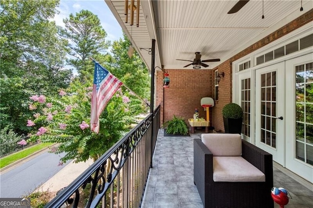 balcony with ceiling fan and french doors