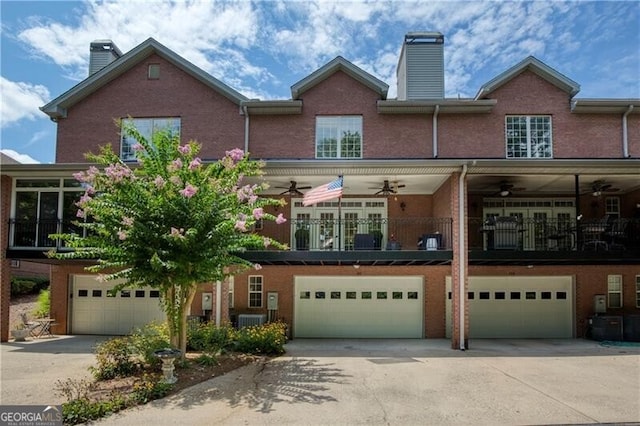 view of front facade with ceiling fan and a garage