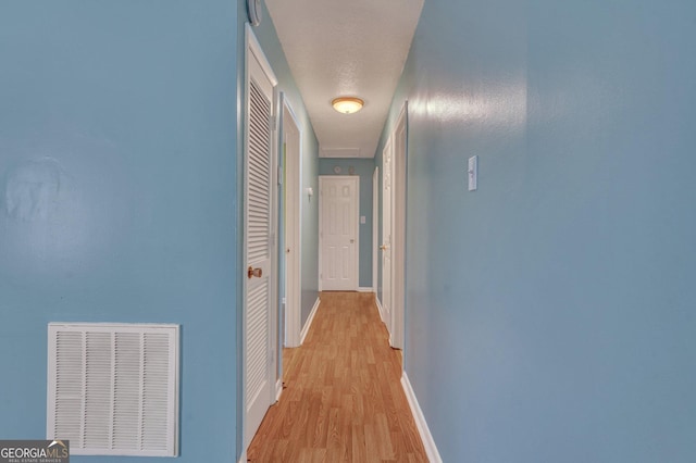 107 Overland Trl, Savannah, GA 31419 - hallway with light wood-style flooring and baseboards