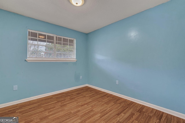 107 Overland Trl, Savannah, GA 31419 - spare room with wood finished floors and baseboards