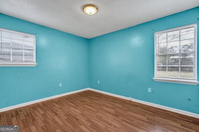 107 Overland Trl, Savannah, GA 31419 - empty room with wood finished floors and a textured ceiling