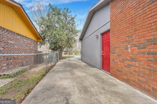 107 Overland Trl, Savannah, GA 31419 - view of property exterior featuring a gate and brick siding