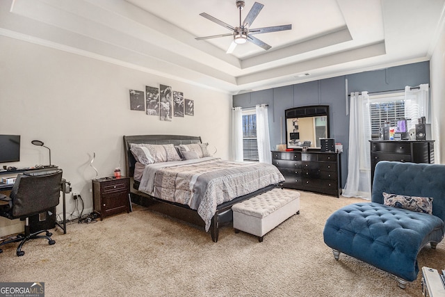 224 Jester Ct, Mcdonough, GA 30252 - bedroom featuring light colored carpet, a ceiling fan, and a tray ceiling