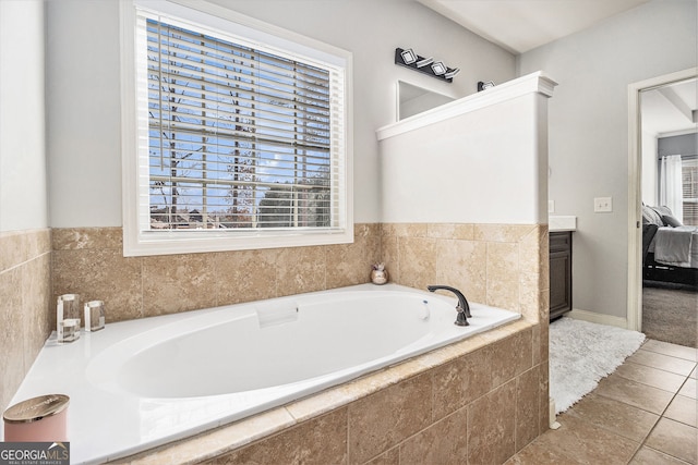 224 Jester Ct, Mcdonough, GA 30252 - ensuite bathroom with tile patterned floors, ensuite bathroom, and a garden tub