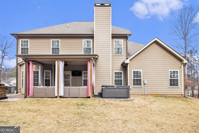 224 Jester Ct, Mcdonough, GA 30252 - rear view of house featuring a chimney, a lawn, a patio area, an outdoor hangout area, and a shingled roof