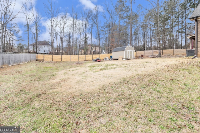 224 Jester Ct, Mcdonough, GA 30252 - view of yard featuring a storage shed, an outdoor structure, and a fenced backyard