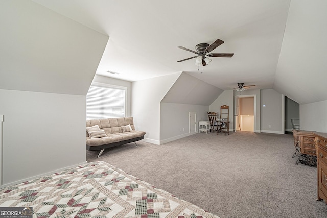 unfurnished bedroom featuring visible vents, baseboards, a ceiling fan, lofted ceiling, and carpet