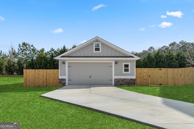 exterior space featuring stone siding, fence, and board and batten siding