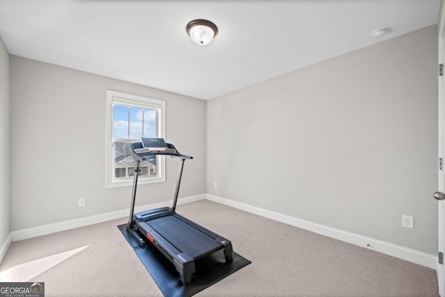 exercise area with carpet flooring and baseboards