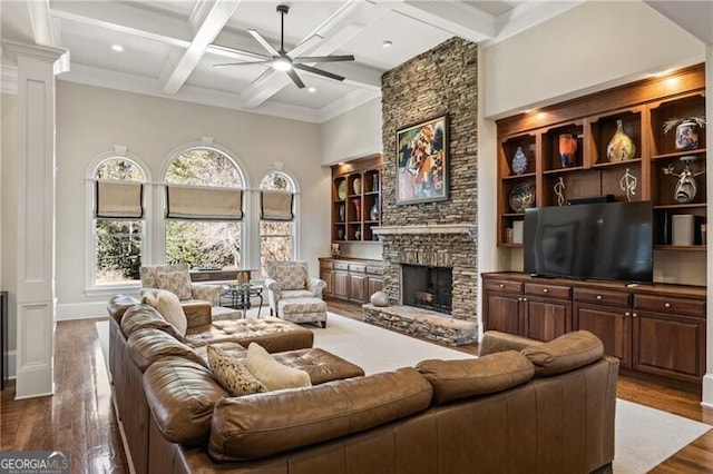 living room with hardwood / wood-style floors, coffered ceiling, ceiling fan, and decorative columns