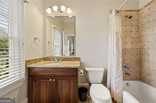 full bathroom featuring toilet, shower / bath combination with curtain, and vanity