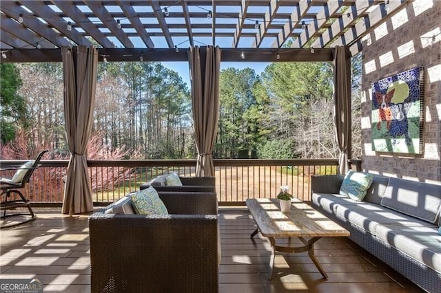 wooden terrace with a pergola and outdoor lounge area