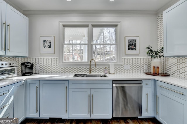 kitchen featuring light countertops, stainless steel dishwasher, a sink, crown molding, and decorative backsplash