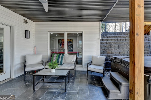 view of patio with ceiling fan and an outdoor hangout area