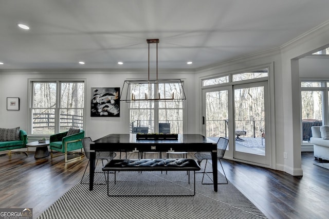 dining room featuring crown molding, dark wood-type flooring, and recessed lighting