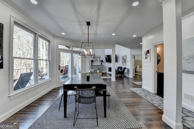 dining area with recessed lighting, crown molding, baseboards, and dark wood-style floors