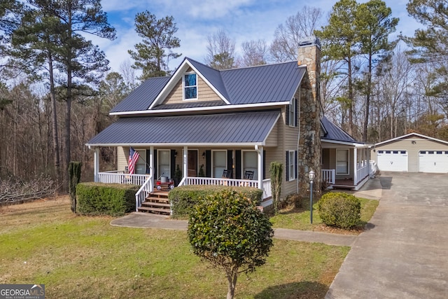 view of front facade featuring covered porch, a front lawn, an outdoor structure, and a garage