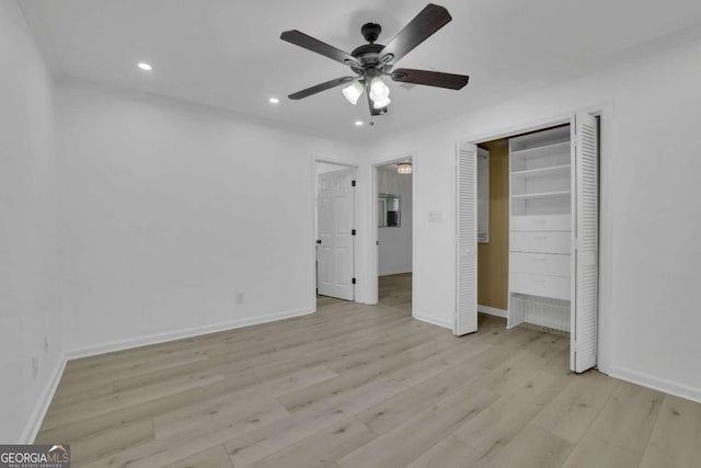 unfurnished bedroom with light hardwood / wood-style floors and ceiling fan