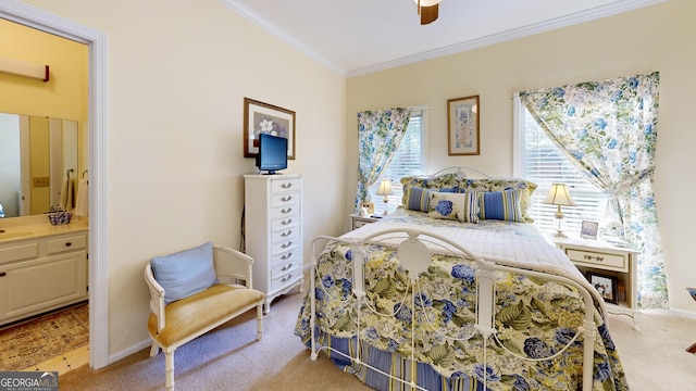 bedroom with connected bathroom, ceiling fan, crown molding, and light colored carpet