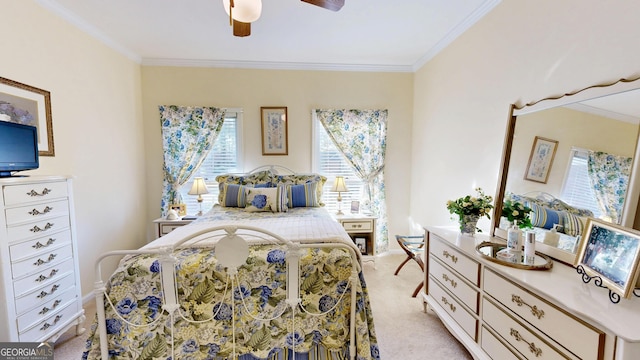 bedroom with light carpet, ceiling fan, and crown molding