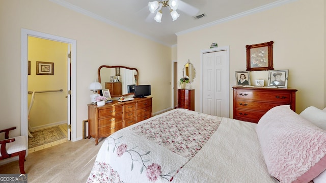 bedroom featuring a closet, ceiling fan, connected bathroom, light carpet, and ornamental molding