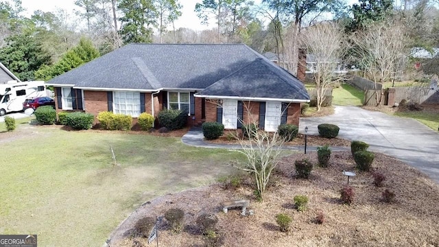 ranch-style house with a front yard