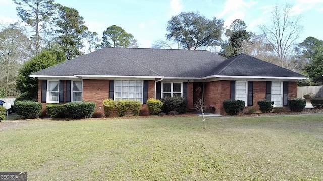 ranch-style home with a front yard