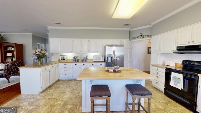 kitchen featuring black range with electric stovetop, a kitchen bar, white cabinetry, and stainless steel fridge with ice dispenser