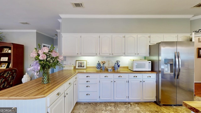 kitchen with decorative backsplash, crown molding, white cabinetry, stainless steel fridge with ice dispenser, and kitchen peninsula