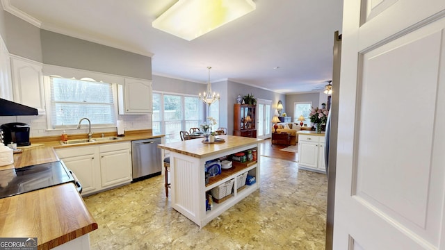 kitchen featuring white cabinetry, dishwasher, pendant lighting, and wood counters