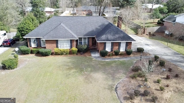 ranch-style home with a front yard