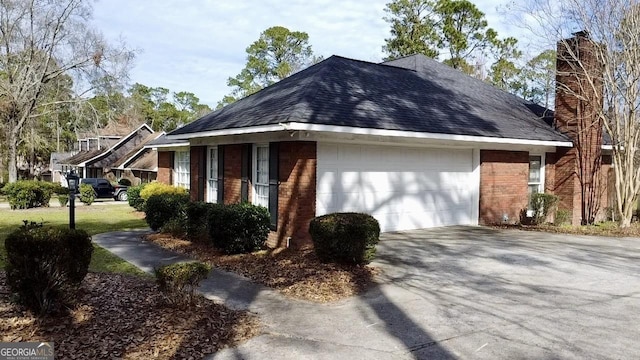 view of side of home with a garage