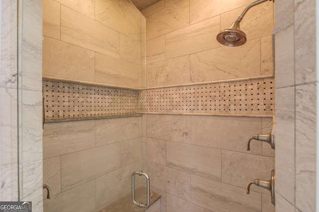 bathroom featuring tiled shower