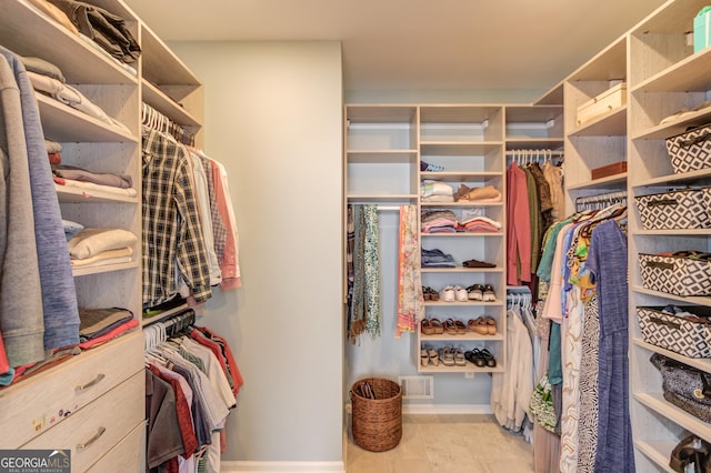 walk in closet with visible vents